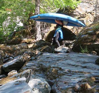 Clear Creek Klamath Basin rafting carrying rubber duckies to the put-in